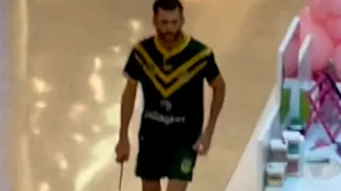 Joel Cauchi holding a knife in the shopping centre