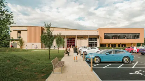 A computed-generated image of what the leisure centre at Five Acres will look like. It is a large, rectangular, modern building with a mix of stone and cladding on the exterior, with large windows revealing a gym where people are exercising. There is paving leading from the car park to the front door, with lots of people heading in.