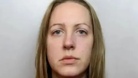 Cheshire Constabulary Lucy Letby looks straight ahead, unsmiling, in her police mugshot
