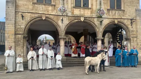 Peterborough Cathedral Palm Sunday service in Cathedral Square 