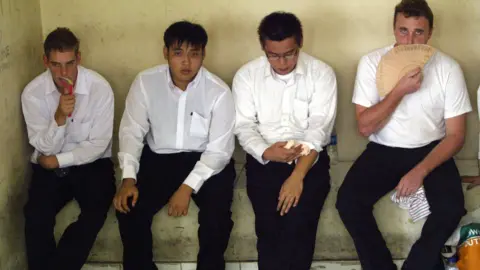 Getty Images Matthew Norman, Tan Duc Thanh Nguyen, Si Yi Chen and Martin Stephens in a cell as they awaited trial in 2005.