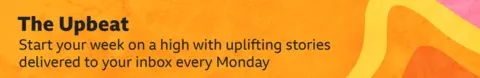 ​​Thin, yellow, orange and pink banner promoting the Upbeat newsletter with text saying, “Start your week on a high with uplifting stories delivered to your inbox every Monday”. There is a pattern of shapes and different shades of colour on the right of the text.
