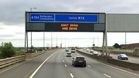 Google A screengrab of the M74 motorway. The sign shows the junction 2 exit at Rutherglen and Cambuslang.