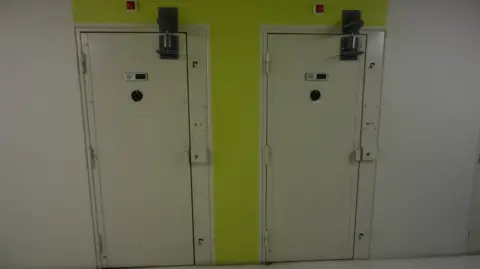 EPA The doors of cells inside the Vendin-le-Vieil prison in northern France as seen on 14/5/2025