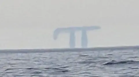 A Fata Morgana in the distance taken from a boat