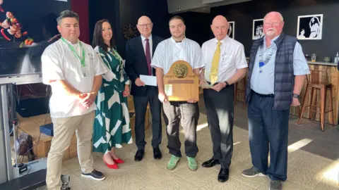 Photo left to right: Chef lecturer TGI College Rivelino Rodriguez, head of department, hospitality & catering TGI College Sally Warburton-Ward,  Carlo Cavagnetto, Harry Gribbens, Mario Cavagnetto and president Lions Club of Guernsey Paul Allaway.