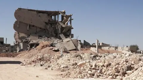 Collapsed building in Kobane - the scene of ferocious fighting in 2014