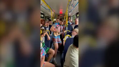 Rugby players on a bus