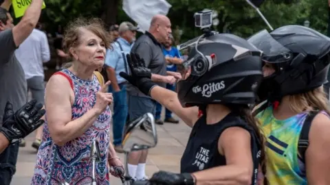 Reuters People protest against mandates to wear masks amid the coronavirus outbreak in Austin, Texas, 28 June 2020