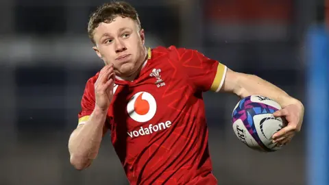 Cardiff wing Tom Bowen runs with the ball for Wales Under-20s against Scotland