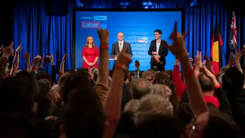 Getty Images A crowd cheers Anthony Albanese on stage