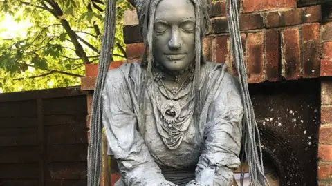 @gettinguptostuff instagram Stature of a woman with her eyes closed