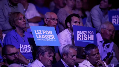 Reuters Supporters of Conservative leadership candidates Rishi Sunak and Liz Truss attend a hustings event, part of the Conservative party leadership campaign, in Exeter