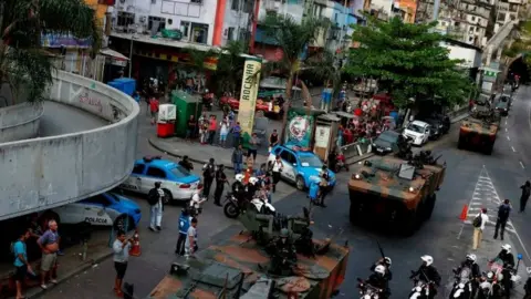 Reuters Armed Forces take up position during a operation after violent clashes between drug gangs in Rocinha slum in Rio de Janeiro, Brazil, September 22, 2017. REUTERS