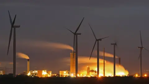 Getty Images windmills and power station
