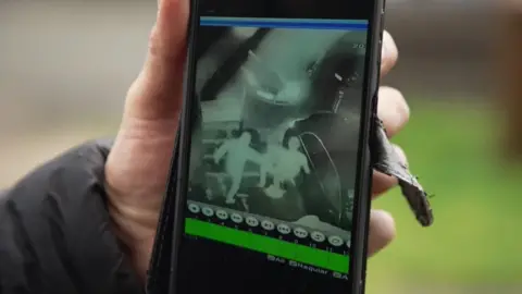 A mobile phone showing CCTV of Stephen being attacked