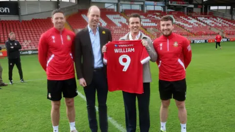 PA Media Prince William, Rob McElhenney, Ben Tozer and Luke Young