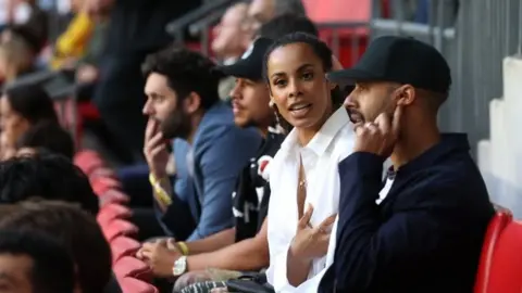Reuters Marvin Humes and Rochelle Humes during the match