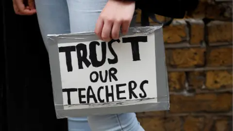 Reuters Trust our teachers sign