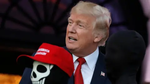 Reuters President Donald Trump gives out Halloween treats at the White House