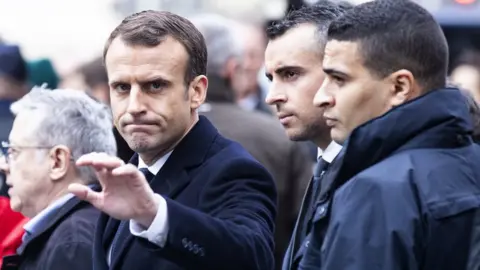 EPA Emmanuel Macron (L)