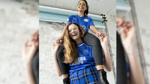 This Fan Girl Amy Drucquer in a picture taken with a friend before lockdown