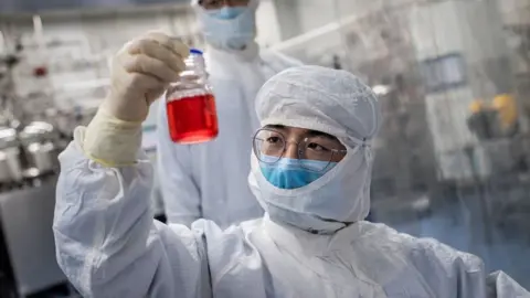 Getty Images Chinese scientist testing vaccine
