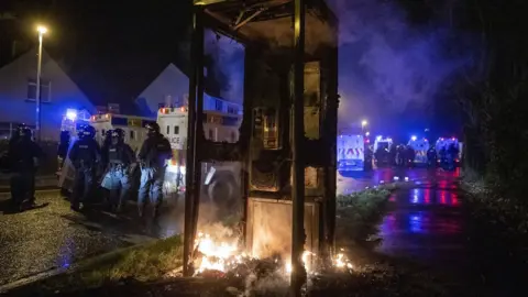 PA Media Police attend unrest in Derry on 5 April