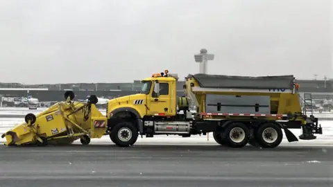 JFK airport/Twitter Gritters clear the runway at John F Kennedy airport