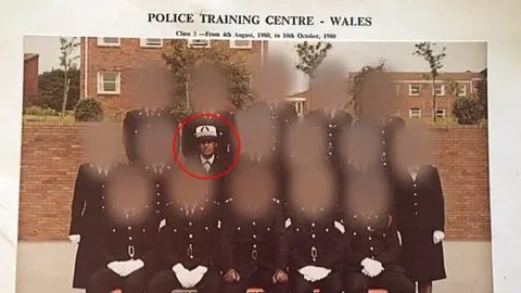 Adora Pomphrey Adora in a police group photo in a training centre in Wales