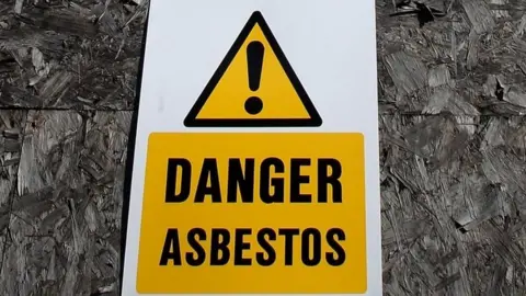 PA Media Asbestos warning sign