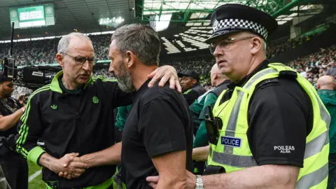 Celtic manager Martin O'Neill, Hearts counterpart and a police officer