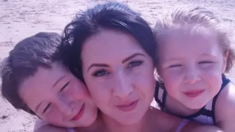 Family handout Kerry Williams (centre) mother of Eboney Cheshire (right) with her other child Leon (left)