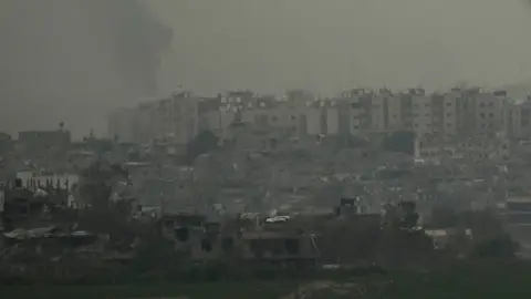 Getty Images Smoke is seen over Beit Hanoun in the Gaza Strip as result of the Israeli attack from the Israeli side of the border on October 27, 2023