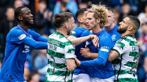 Rangers and Celtic players clash