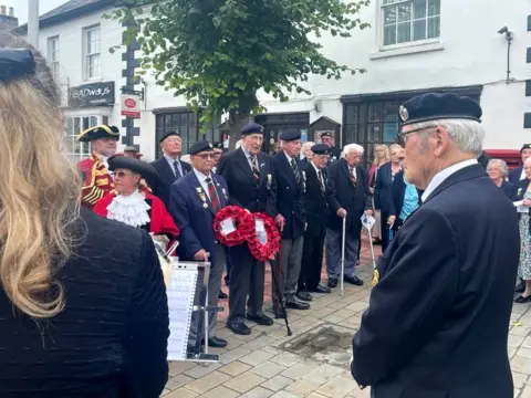 Veterans hold wreaths at a ceremony in Royal Wootton Bassett