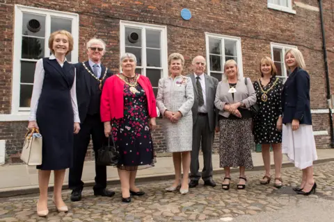 Durham County Council Guests gather at the unveiling of the blue plaque at 9 South Bailey 