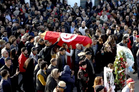 EPA People carry the coffin of of the Human rights defender, internet-activist, and blogger Lina Ben Mhenni, who was previously nominated for the Nobel Peace prize in Tunis, Tunisia, 28 January 2020