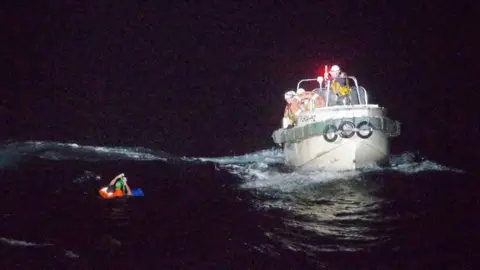 Reuters Patrol ship rescuing a seaman