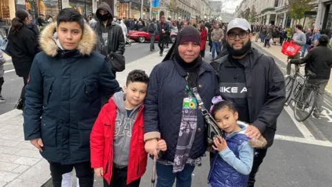 Hamza on the right, with his mother, two younger brothers and younger sister