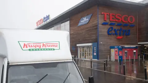 PA Media Krispy Kreme donut van outside Tesco Extra store in Wisbech