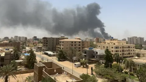 Getty Images Building on fire in Khartoum