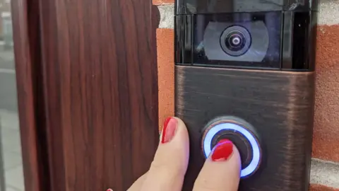 BBC finger pushing doorbell