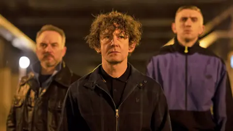 Ian Hart (centre) as drug dealer Carl