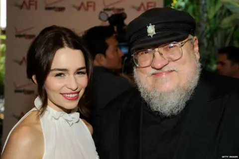Getty Images Emilia Clarke and George RR Martin