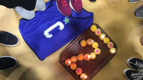 Heather Lewis A netball bib for the "centre" position and cup cakes in the shape of the number 2.