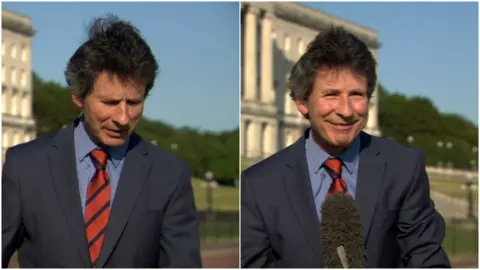 BBC Mark Devenport as his microphone blows away on live TV
