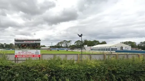 Google Picture of stadium showing Henlow Racing sign and white spectator building