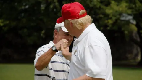 Getty Images Michael Bloomberg (left) and Donald Trump at a golf course in New York. Photo: July 2007