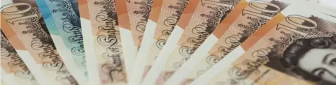 Getty Images Ten and five pound notes